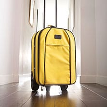 a yellow suitcase in the hallway